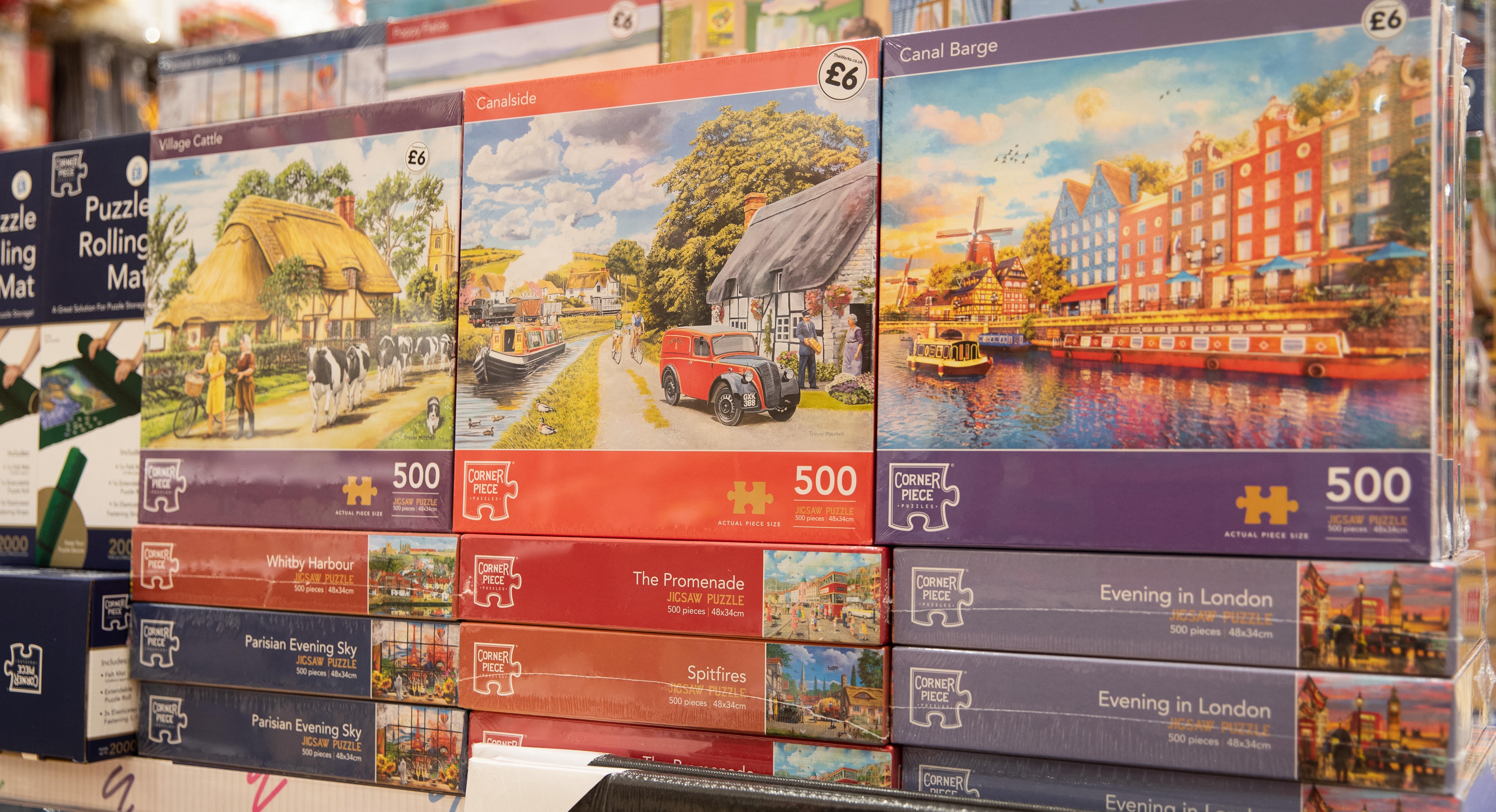 stacked piles of jigsaw puzzles from The Works