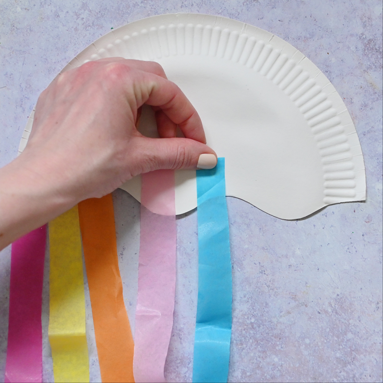 Glue the tissue paper to the plate