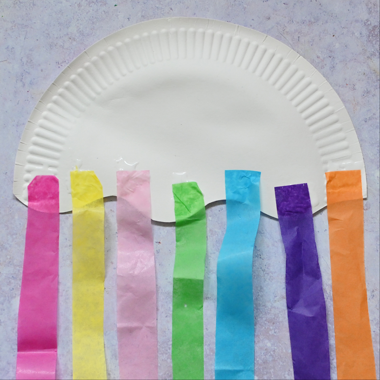 Glue the tissue paper to the plate